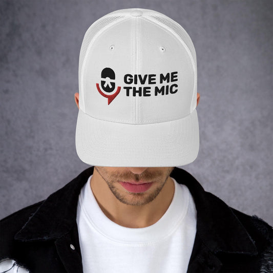 Trucker cap with "Give Me The Mic" embroidery, mesh back, and adjustable closure.